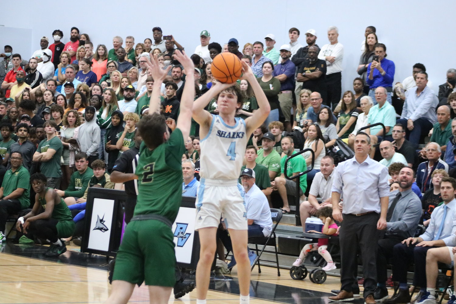 J.T. Kelly launches a three-pointer. He had 12 points in the regional championship.
